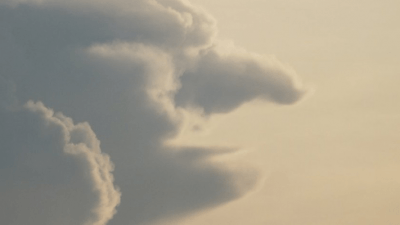 Zwanghaft sehen: Gesicht in einer Wolke